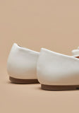 Missy White textured bow ballerinas