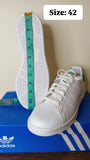 Adidas solid white perforated shoes (Box packaging)